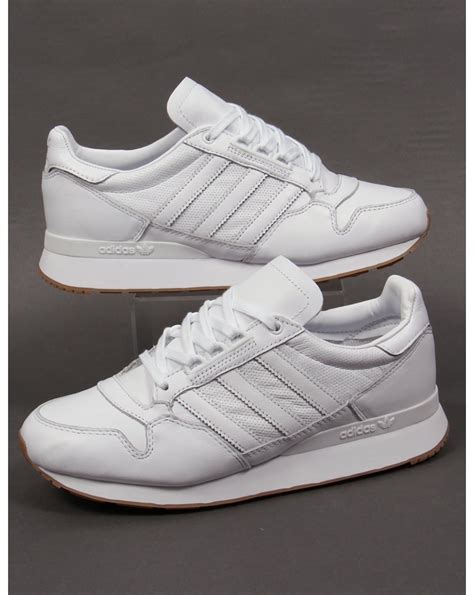 white leather adidas sneakers.